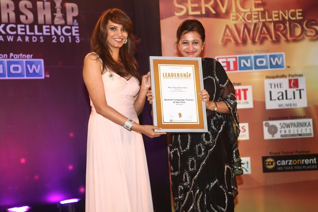 Mrs. Vidya Govindani being awarded the certificate for the Spanish Language Trainer of the Year 2013 in Mumbai by Diana Hayden