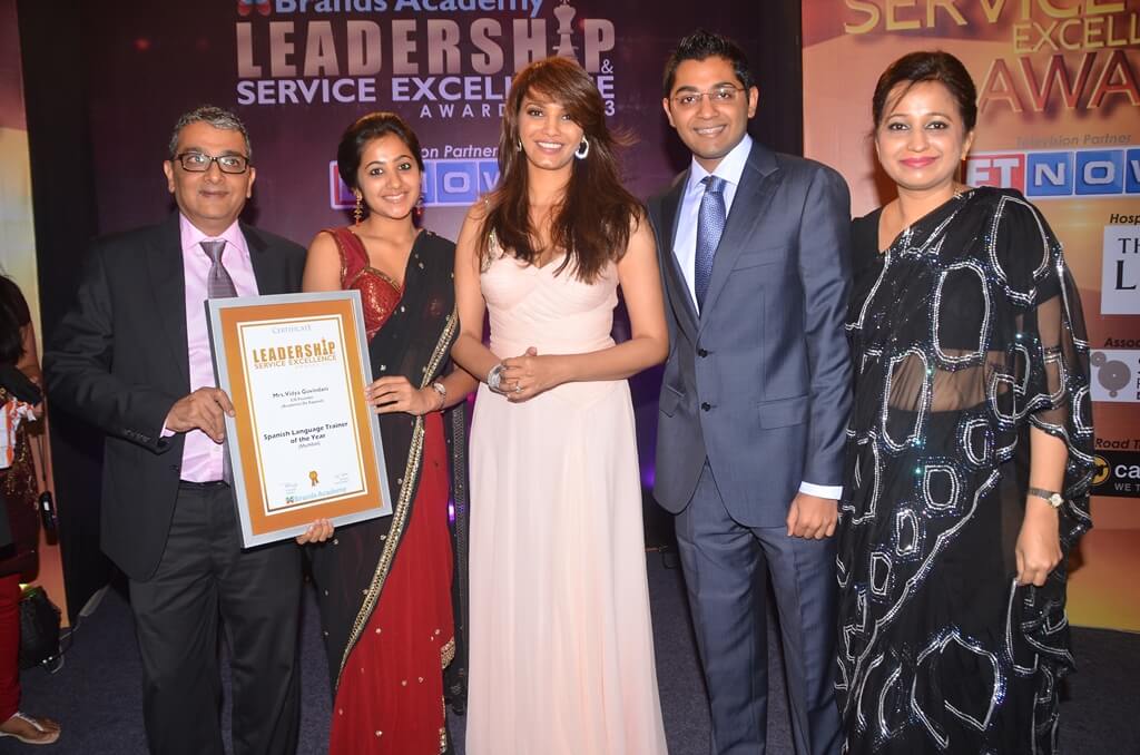 The Govindani family posing with the certificate awarded by Diana Hayden