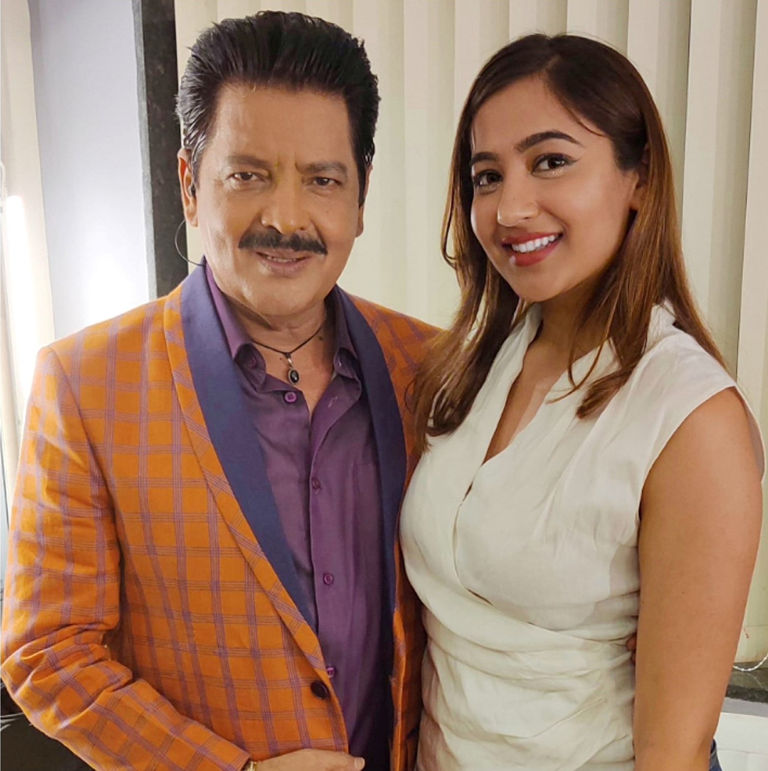 Twinkle Govindani with Bollywood playback singer Udit Narayan